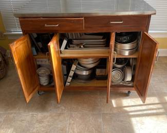 D16 - $150. Home Styles Rolling Kitchen Cart with storage and a drop leaf. Measures 43” wide x 20” deep x 35” tall. 30” deep with extension up.  Needs a little cleaning but very good condition!