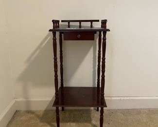 D12 - $50.  Vintage Telephone Table with small drawer and shelf. Measures 13.5” wide x 1.5” deep x 28” tall. 
