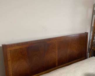 D25 - $400. Stanley bedroom set. Queen size bed, side table, tall, dresser, short dresser with two wall hanging mirrors. Bedside table measures 25” wide x 16” deep x 21.75” tall. Top is worn. Veneer chipped on the bottom.  Tall dresser measures 36” wide x 18.5” deep x 54” tall. Four drawers and three cubbies. Wear on doors from use.  Queen size headboard 49” tall. Mattress was used with a cover on it. Frame is on wheels. Frame is attached to the headboard. Long dresser measures 74” wide x 18.5” deep x 29.5 inches tall. Nine drawers. Some wear and veneer chipped off. Solid construction. Two mirrors measure 19“ wide x 45“ tall. 