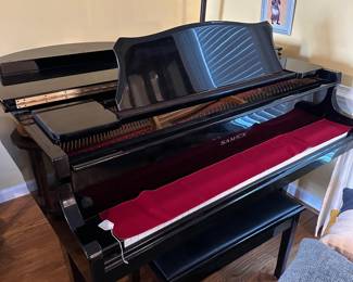 D5 - $3000. Samick black lacquered piano with bench. Last 2 keys stick a bit. 