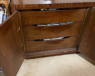 D25 - $400. Stanley bedroom set. Queen size bed, side table, tall, dresser, short dresser with two wall hanging mirrors. Bedside table measures 25” wide x 16” deep x 21.75” tall. Top is worn. Veneer chipped on the bottom.  Tall dresser measures 36” wide x 18.5” deep x 54” tall. Four drawers and three cubbies. Wear on doors from use.  Queen size headboard 49” tall. Mattress was used with a cover on it. Frame is on wheels. Frame is attached to the headboard. Long dresser measures 74” wide x 18.5” deep x 29.5 inches tall. Nine drawers. Some wear and veneer chipped off. Solid construction. Two mirrors measure 19“ wide x 45“ tall. 