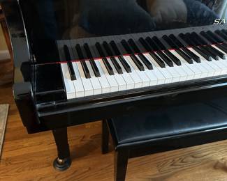 D5 - $3000. Samick black lacquered piano with bench. Last 2 keys stick a bit. 