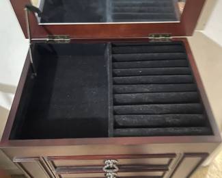 D24 - $40. Queen Anne style wooden jewelry box. Cherry finish. Measures 15.75” wide x 12” deep x 40” tall.  Some light scratches but overall good condition. Felt in the bottom two drawers is peeling, but easily repairable.