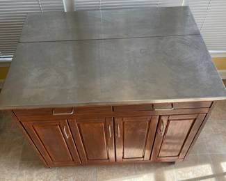 D16 - $150. Home Styles Rolling Kitchen Cart with storage and a drop leaf. Measures 43” wide x 20” deep x 35” tall. 30” deep with extension up.  Needs a little cleaning but very good condition!
