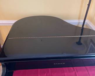 D5 - $3000. Samick black lacquered piano with bench. Last 2 keys stick a bit. 