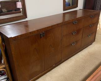 D25 - $400. Stanley bedroom set. Queen size bed, side table, tall, dresser, short dresser with two wall hanging mirrors. Bedside table measures 25” wide x 16” deep x 21.75” tall. Top is worn. Veneer chipped on the bottom.  Tall dresser measures 36” wide x 18.5” deep x 54” tall. Four drawers and three cubbies. Wear on doors from use.  Queen size headboard 49” tall. Mattress was used with a cover on it. Frame is on wheels. Frame is attached to the headboard. Long dresser measures 74” wide x 18.5” deep x 29.5 inches tall. Nine drawers. Some wear and veneer chipped off. Solid construction. Two mirrors measure 19“ wide x 45“ tall. 