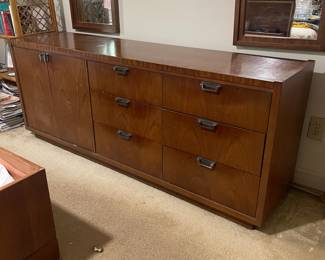 D25 - $400. Stanley bedroom set. Queen size bed, side table, tall, dresser, short dresser with two wall hanging mirrors. Bedside table measures 25” wide x 16” deep x 21.75” tall. Top is worn. Veneer chipped on the bottom.  Tall dresser measures 36” wide x 18.5” deep x 54” tall. Four drawers and three cubbies. Wear on doors from use.  Queen size headboard 49” tall. Mattress was used with a cover on it. Frame is on wheels. Frame is attached to the headboard. Long dresser measures 74” wide x 18.5” deep x 29.5 inches tall. Nine drawers. Some wear and veneer chipped off. Solid construction. Two mirrors measure 19“ wide x 45“ tall. 