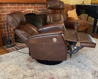 D4 - $750 each. 2 available. Haverty’s Magnus leather power swivel recliners. Brandy color pattern.  These are on the smaller side. Ideal for someone around 5’5”.   Measures 32”wide x 31”deep x 39” tall. Extremely comfortable and in great condition. No pets or smoking. 