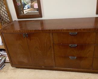 D25 - $400. Stanley bedroom set. Queen size bed, side table, tall, dresser, short dresser with two wall hanging mirrors. Bedside table measures 25” wide x 16” deep x 21.75” tall. Top is worn. Veneer chipped on the bottom.  Tall dresser measures 36” wide x 18.5” deep x 54” tall. Four drawers and three cubbies. Wear on doors from use.  Queen size headboard 49” tall. Mattress was used with a cover on it. Frame is on wheels. Frame is attached to the headboard. Long dresser measures 74” wide x 18.5” deep x 29.5 inches tall. Nine drawers. Some wear and veneer chipped off. Solid construction. Two mirrors measure 19“ wide x 45“ tall. 