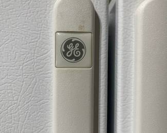D33 - $100. GE Side by Side refrigerator/freezer. Works. Kept in garage. 