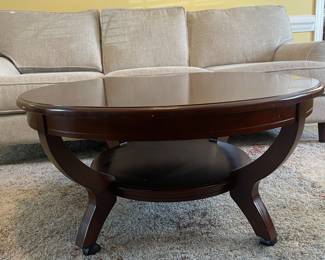 D7 - $125. Haverty’s coffee table. Very solid and sturdy. Measures 40” diameter x 19” tall. Matching end tables also available. 