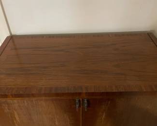 D25 - $400. Stanley bedroom set. Queen size bed, side table, tall, dresser, short dresser with two wall hanging mirrors. Bedside table measures 25” wide x 16” deep x 21.75” tall. Top is worn. Veneer chipped on the bottom.  Tall dresser measures 36” wide x 18.5” deep x 54” tall. Four drawers and three cubbies. Wear on doors from use.  Queen size headboard 49” tall. Mattress was used with a cover on it. Frame is on wheels. Frame is attached to the headboard. Long dresser measures 74” wide x 18.5” deep x 29.5 inches tall. Nine drawers. Some wear and veneer chipped off. Solid construction. Two mirrors measure 19“ wide x 45“ tall. 