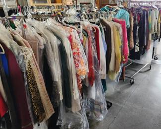7 six foot racks of quality ladies clothing. Most sized Medium