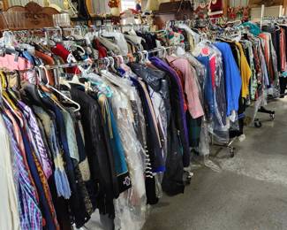 7 six foot racks of quality ladies clothing. Most sized Medium