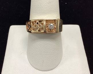 14k mens diamond ring 7.2 grams 7.2 grams, sz 9.5 featuring 15pt rnd diamond and nugget style cutout pattern