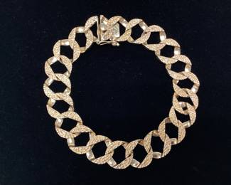 8.25inch 14k 13mm Curb link 31.1 grams This bracelet features nugget style texture outside and smooth polish inside for comfortable everyday wear