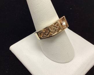 14k mens diamond ring 7.2 grams 7.2 grams, sz 9.5 featuring 15pt rnd diamond and nugget style cutout pattern
