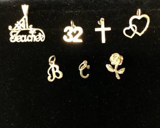  14k gold lot 7.9 grams This lot features 17 inch curb link, rose, hearts, cross, B, C, 32, teacher pendants or charms