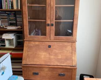 #62	Secretary desk laminent 2 drawers, 2 glass doors, flip down desk 34x22-35x77"	 $75.00 			