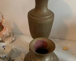 #146	Pair of brass vases 5" and 10"	 $25.00 			