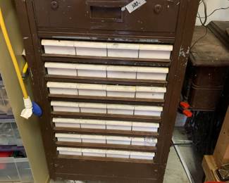 #86	Metal Cabinet on wheels 28 drawers w contents 21x18x41"	 $100.00 			