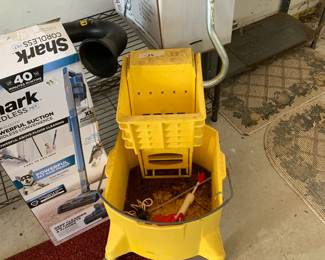 #94	Yellow professional grade mop bucket w ringer 	 $35.00 			