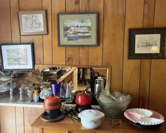 paintings, cookware, accent table