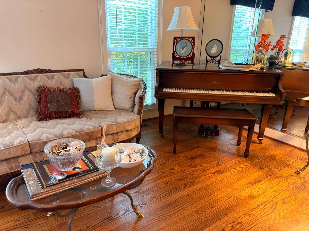 Whitney baby grand piano with Victorian settee