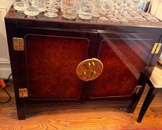 Asian burlwood cabinet with brass hardware