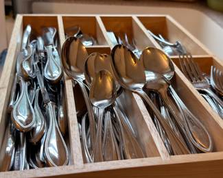 Flatware set in wooden drawer organizer
