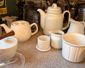 White ceramic teapots and serving pieces