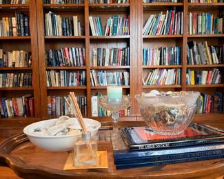 Extensive collection of books on wooden bookshelves