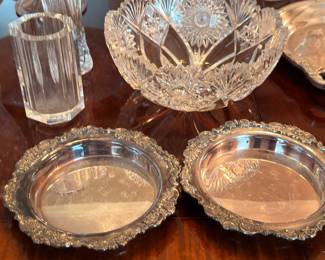 Silver-plate serving bowls and cut crystal pieces