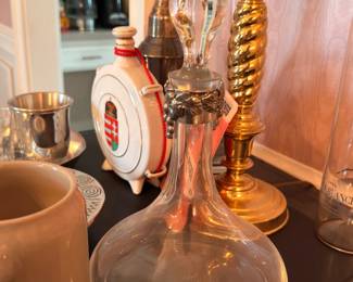 Crystal decanter with brass candlesticks