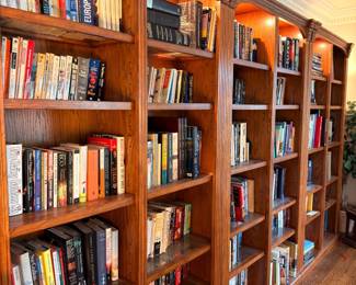 Wall of built-in wooden bookshelves with books