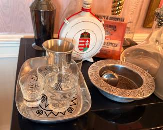 Assorted barware and silver-tone serving pieces