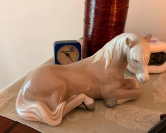 Large porcelain reclining horse figurine