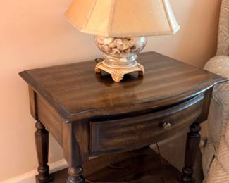Dark wood one-drawer end table with turned legs