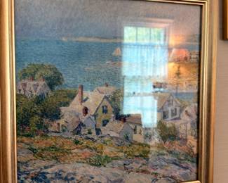 Framed impressionist coastal village print in gilt frame