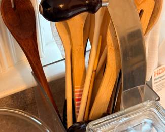 Wooden kitchen utensils in glass holder