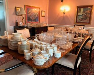 Dining table with china, crystal, and tea sets