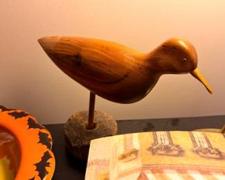 Carved wood shorebird decoy on stand