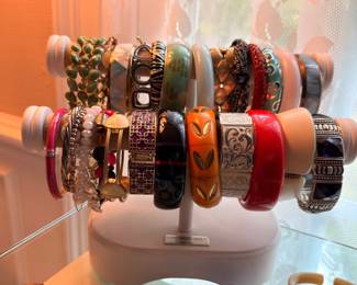 Large bangle bracelet collection on stand