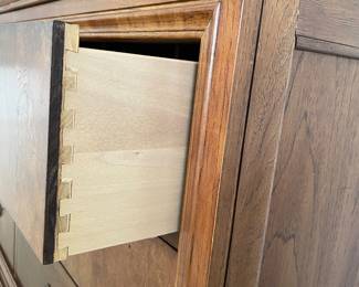 Close up of side view of 12 drawer credenza showing dovetailing on drawers (we believe this bedroom set is from the Elysee Collection)