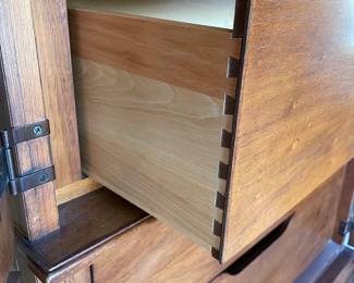 Close up of side view of armoire showing dovetailing on drawers (we believe this bedroom set is from the Elysee Collection)