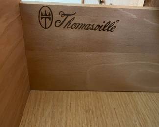 Wood branded with Thomasville maker's mark on interior drawer on 12 drawer credenza 
