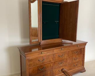 Middle compartment of trifold mirror on Thomaville 12 drawer credenza features a hidden 'pop-open' green velvet lined jewelry storage area 