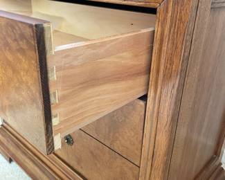 Side view of nightstand showing dovetailing on drawers (we believe this bedroom set is from the Elysee Collection)