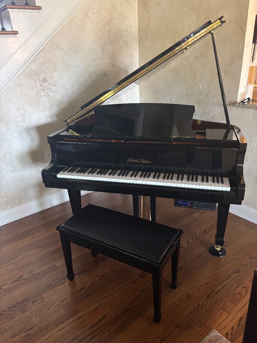 Pearl River Baby Grand piano Model GP142 4' 7"--features a player disc system with integrated speakers and matching bench.  Excellent condition.