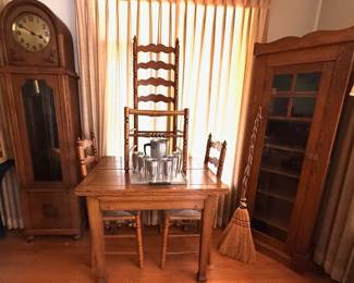 French Country style ladder back chairs w/rush seats.  Turned legs and stiles.  Art deco long/tall case.